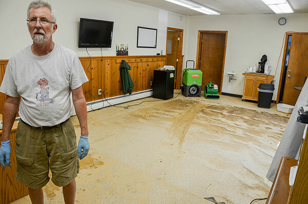 Richard Blood, a trustee at Emory UMC in Ellicott City, stands in the church’s Education Building Aug. 1 as they work to clean up from the flash flood of Saturday, July 30. Photo by Alison Burdett.